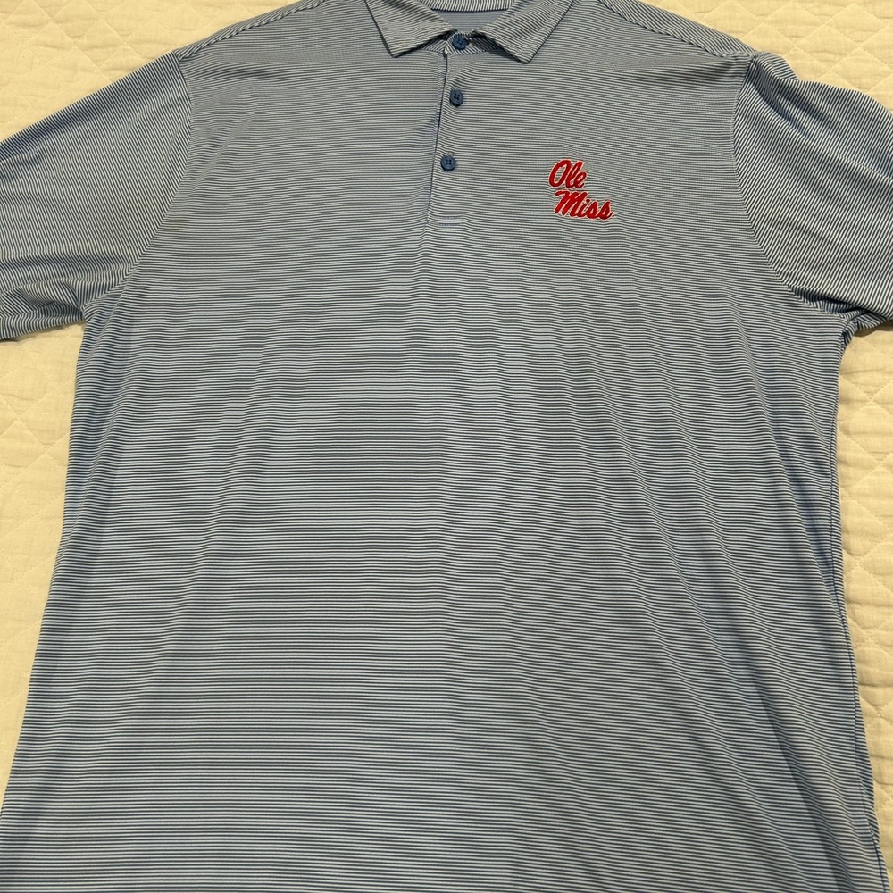 Antigua Men’s powder blue striped polo with Ole Miss logo